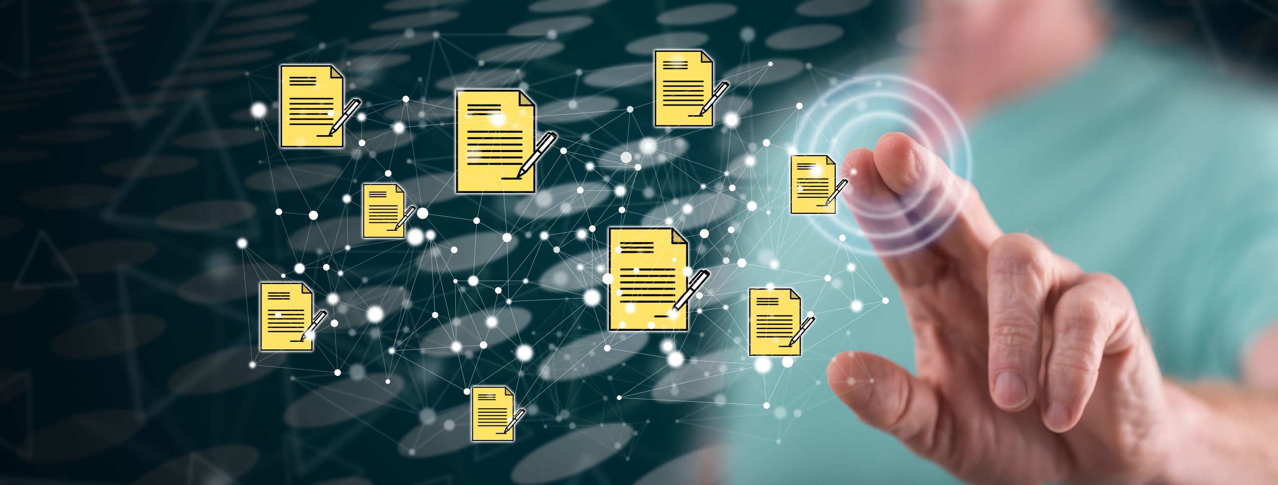 Digital image of yellow documents with a hand selecting them