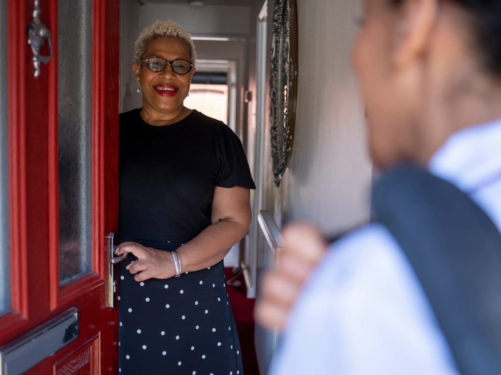 Nurse visiting woman at her house