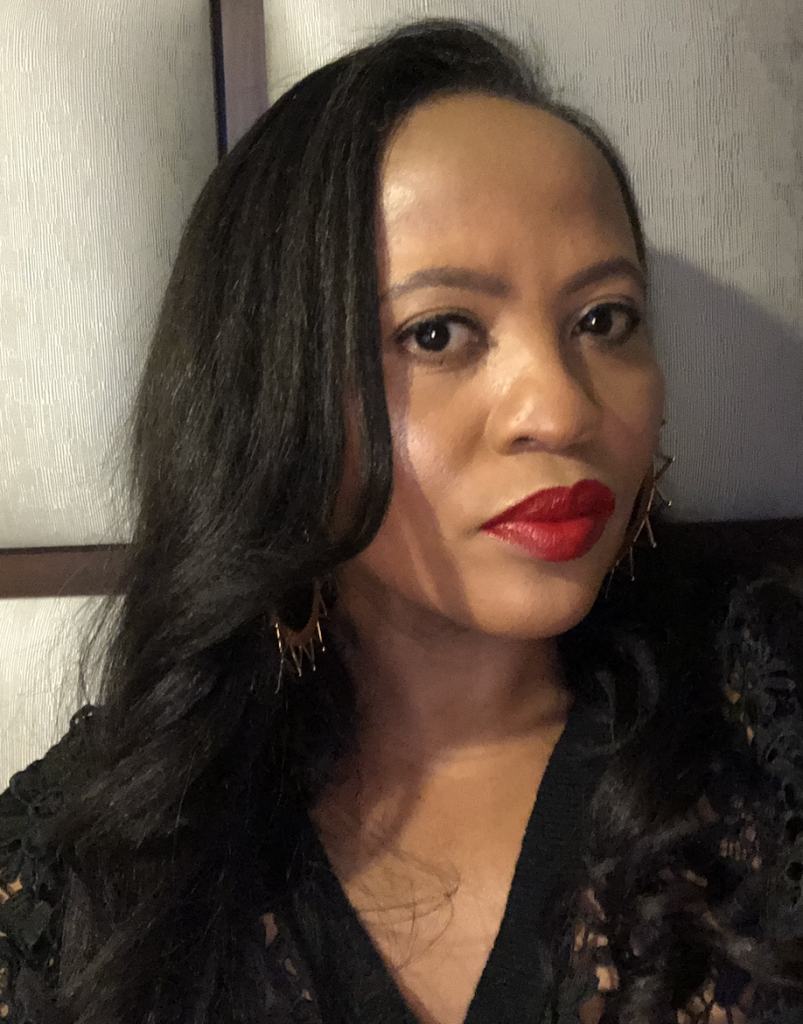 Black female with red lipstick and black jumper