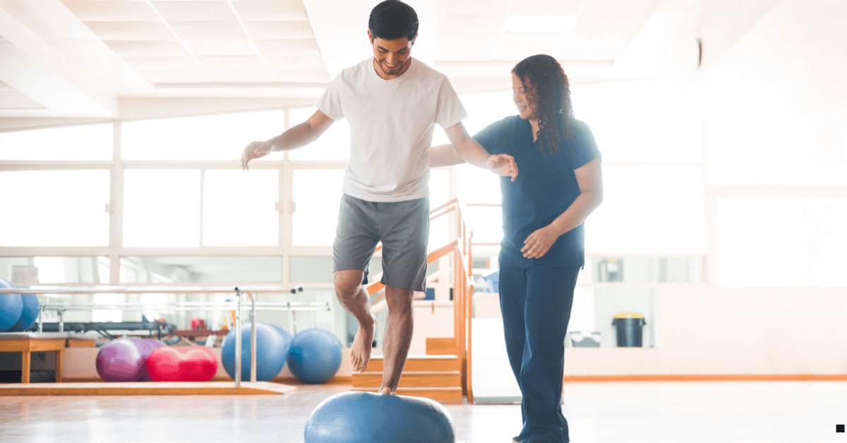 White male a physio being supported by a physio nurse