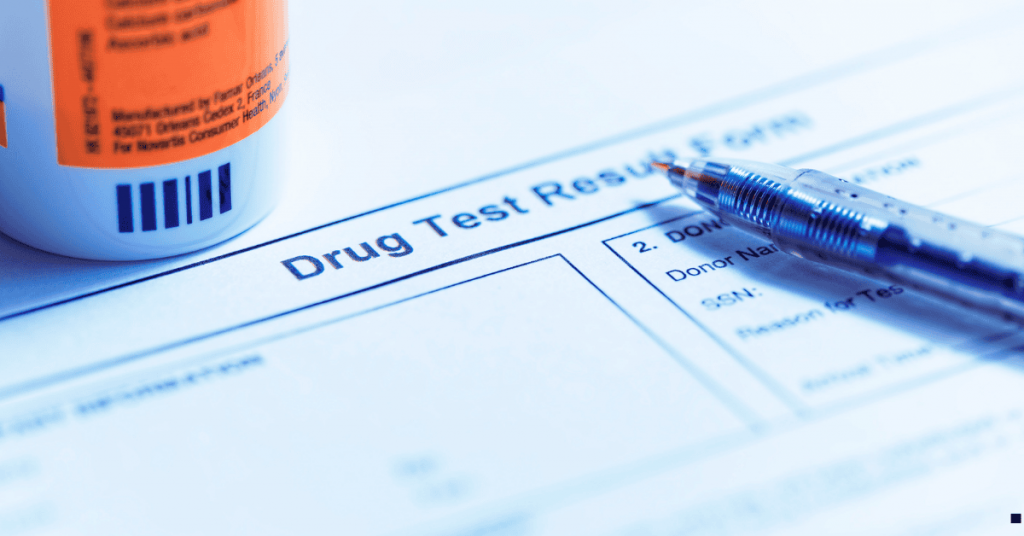 Drug Test Results sheet with a pen