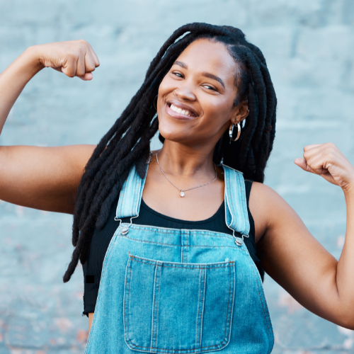 Black woman with dreadlocks posing strong
