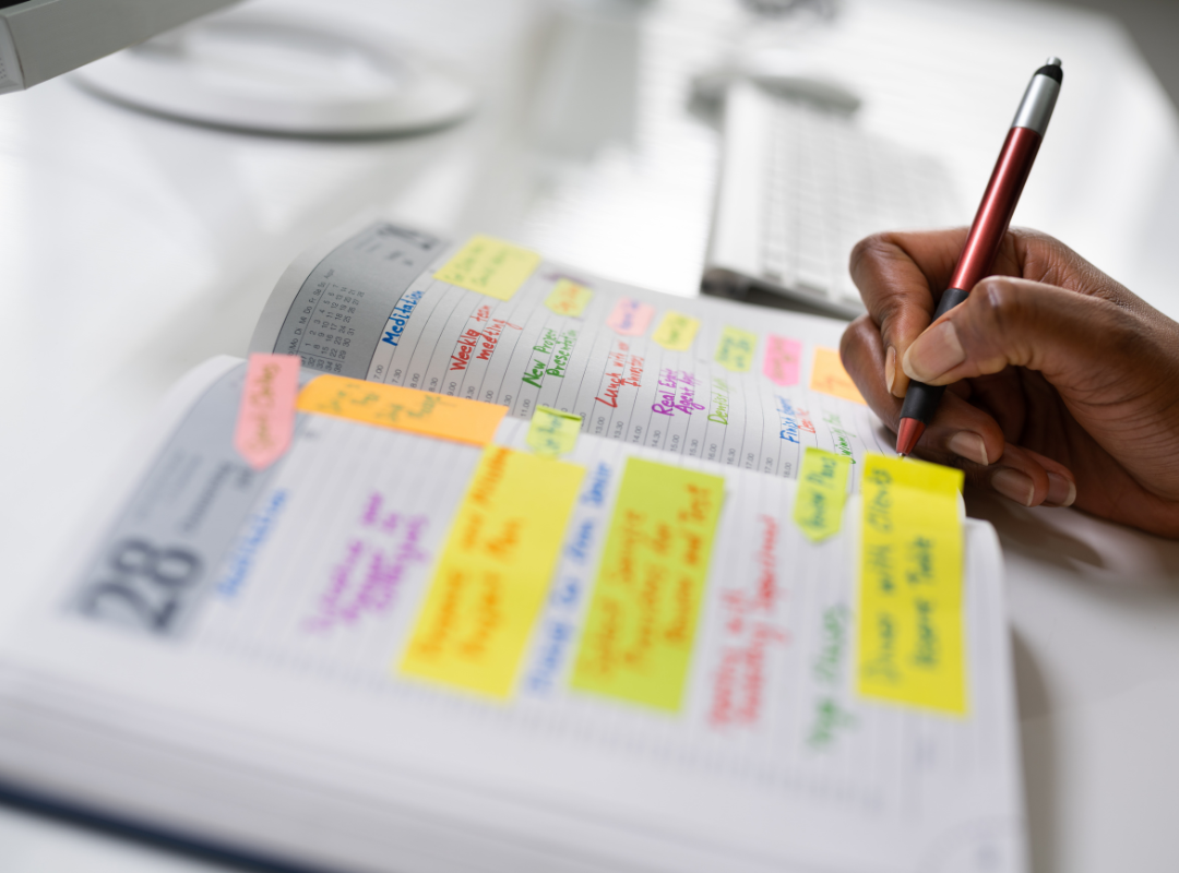 Open diary showing a black woman making a journal entry