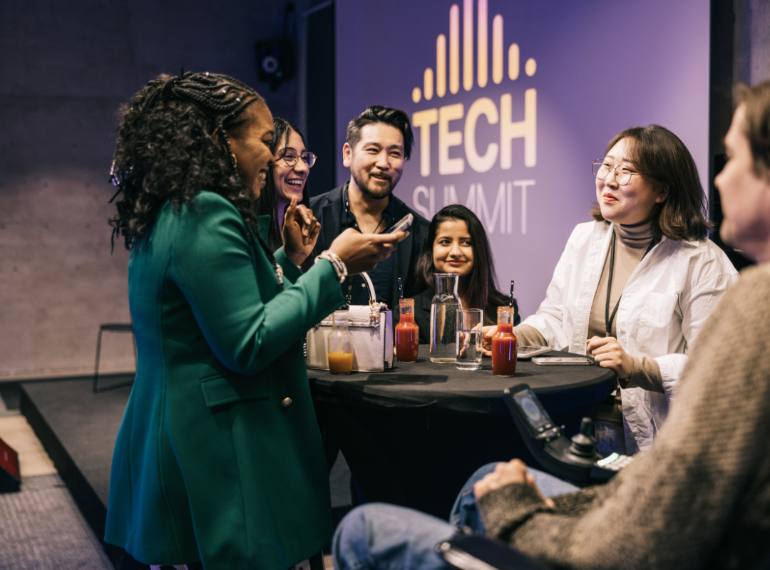 A mixed group of people attending Tech summit