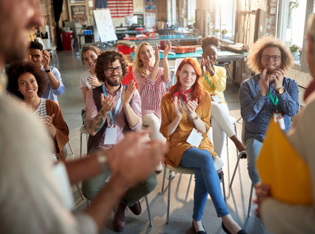 A group of mainly white people at a training 